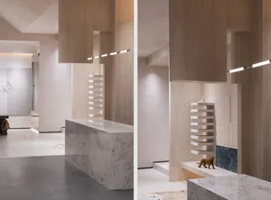 Modern office entry with concrete and marble materials.
