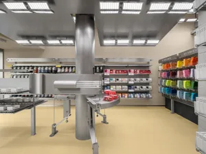 Interior of an industrial retail store featuring metal and plastic displays.