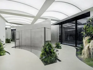 Modern interior space with concrete walls and glass features