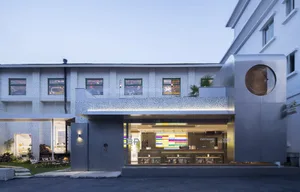 A modern storefront with metallic finishes and colorful accents.