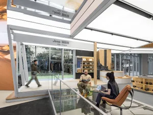 A sleek, modern storefront with metal exterior and glass doors.
