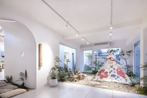 Minimalist décor featuring a concrete floor and large windows in a living room setting.