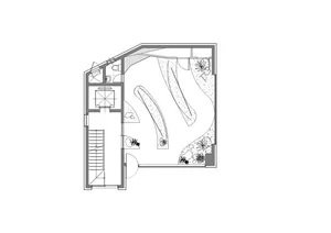 Concrete playground floor plan with curved pathways and vegetation.