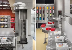 A modern retail store with mechanical components and multicolored products on shelves.