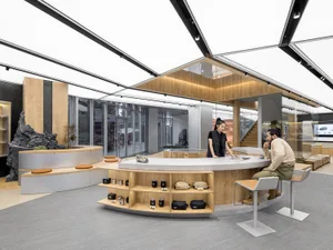 A modern retail shop interior featuring wooden and concrete elements