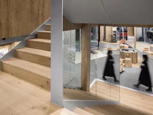 Modern storefront with wooden features and glass windows.