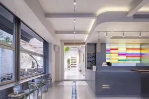 Shop interior with modern design featuring a white concrete floor and transparent glass storefront