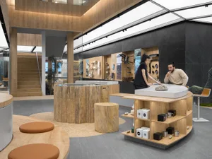A retail storefront featuring a modern, minimalist design with natural wood textures and a spacious layout.