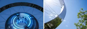 A metallic structure with digital blue light display.