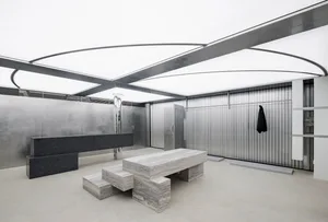 Modern industrial interior featuring concrete and metal materials