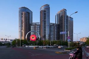 Modern cityscape featuring glass buildings at dusk