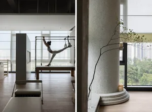 A modern minimalist interior with white walls and wooden floors.