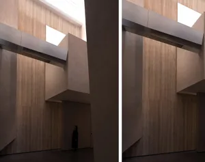 A minimalist interior space featuring concrete and wood elements.