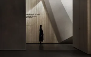 A minimalist interior design featuring concrete materials and geometric shapes.
