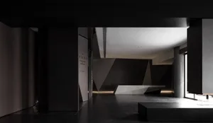 Modern interior design featuring black walls and white flooring in an office setting.