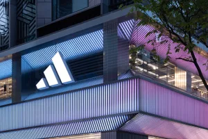 Modern metal architecture featuring vertical lines and angular shapes resembling a wave