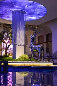 Modern minimalist interior design featuring a metallic deer statue