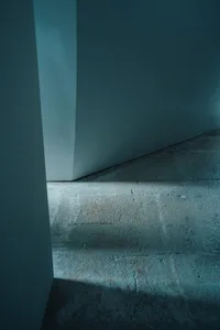 A modern concrete stairwell interior with minimalistic design.