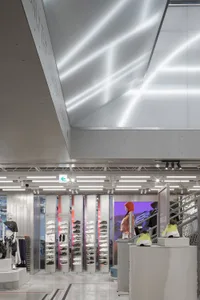 A modern retail store showcasing a metallic shoe display.