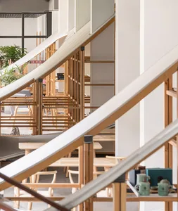 Modern cafe interior featuring wooden furniture and minimalistic design