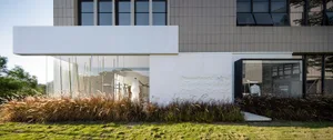 A modern retail storefront featuring glass and metal elements.