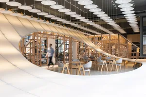 A modern cafe interior featuring wood materials.