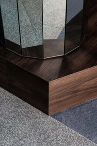 A modern interior design featuring a terrazzo floor with a reflective surface.