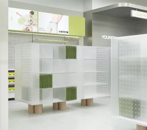 A retail store featuring modern, transparent plastic pods arranged in a grid pattern