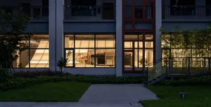 A modern office space featuring glass and metal materials.