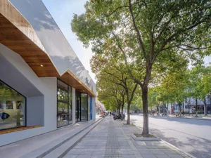 Modern storefront with concrete and glass materials.