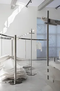 Modern retail storefront with paper installations and metal structures
