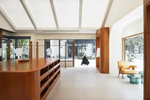 A modern retail storefront with wooden fixtures and a minimalist design.