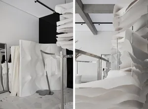 Modern minimalist fashion retail store featuring paper textiles and concrete architectural elements.