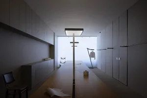 Modern clothing studio with minimalist design using concrete, metal, and glass materials.