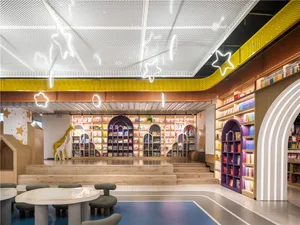 A modern children's library interior with colorful wooden shelves, bright neon signs, and a cozy seating area
