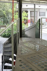 Inside a modern building with concrete floor and stairs