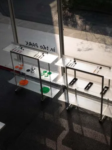 Glass-paneled metal rack displayed in a storefront window.