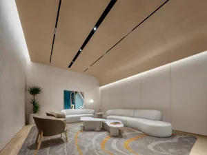 A modern interior living room with textured canvas walls, curved sofas, and minimalist decor.