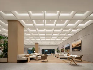 Modern office space featuring minimalist design with wood and leather materials.