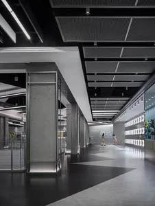 A modern retail store with concrete interiors and glass walls