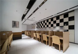 A neatly arranged study space with wooden furniture, desks, and chairs.