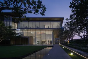 Modern building with glass and concrete exterior at dusk