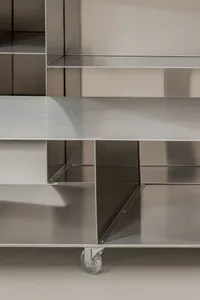 Clean-lined, metal shelving unit with wheels.