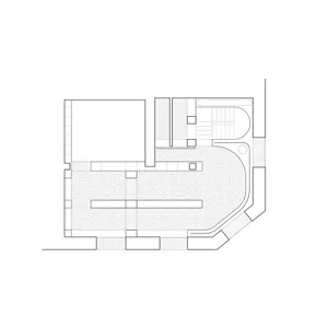 A black and white architectural drawing of an interior space featuring concrete steps and a staircase.