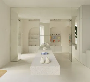 Modern minimalist retail shop with a terrazzo stone counter.