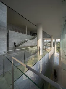 Modern interior space featuring glass and marble materials.