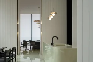 A modern kitchen featuring sleek marble countertops and minimalist design.
