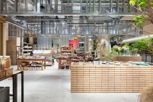 Modern retail shop featuring industrial design elements made of wood, metal, and glass