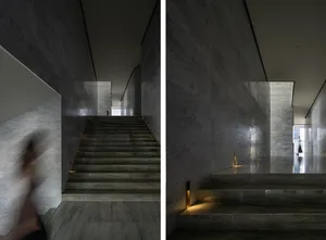 Staircase with minimalist marble and concrete design features