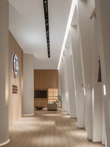 Modern corridor with wooden furniture and lounge area